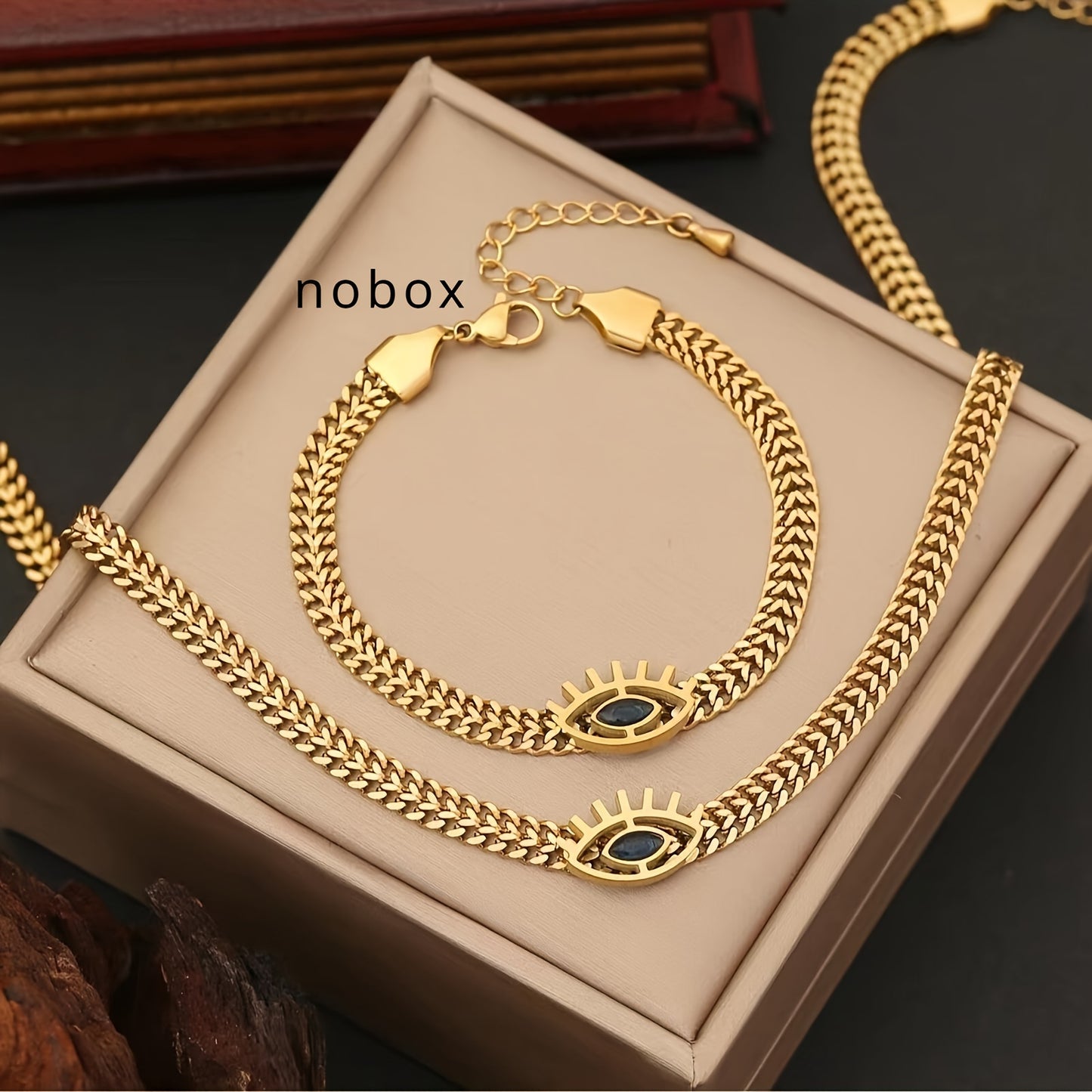 2pcs Golden Stainless Steel Hollow Eye Necklace And Bracelet Set